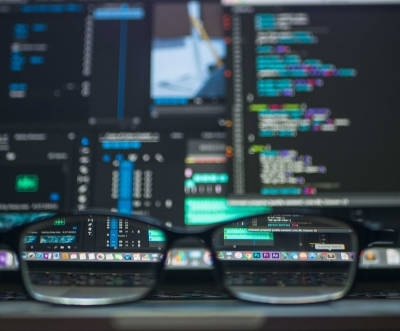 Picture of glasses in front of a computer screen.